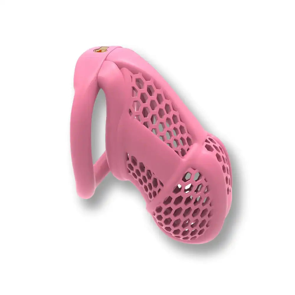 Cage de chasteté rose en silicone avec design nid d'abeille pour sissification et soumission sexuelle sur Sissyshop