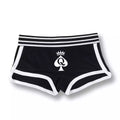 Déclinaison noire classique de ce mini short avec taille élastique et finitions contrastées, parfait pour affirmer le style qos lors de vos moments sissification sur sissyshop.