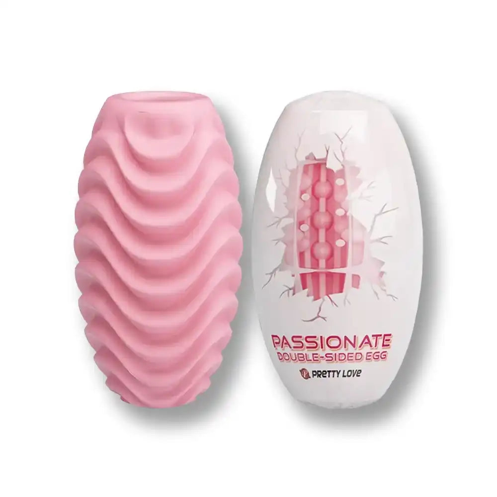 Oeuf vibrant rose en silicone souple pour sissification et plaisir anal, design texturé double face sur Sissyshop