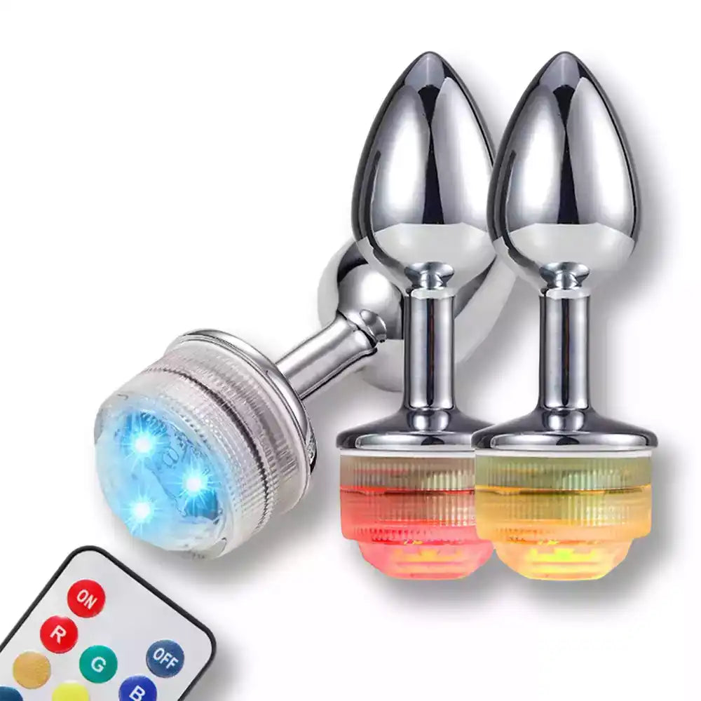 Plug anal métallique avec lumière LED multicolore et télécommande pour sissification et fétichisme sur Sissyshop