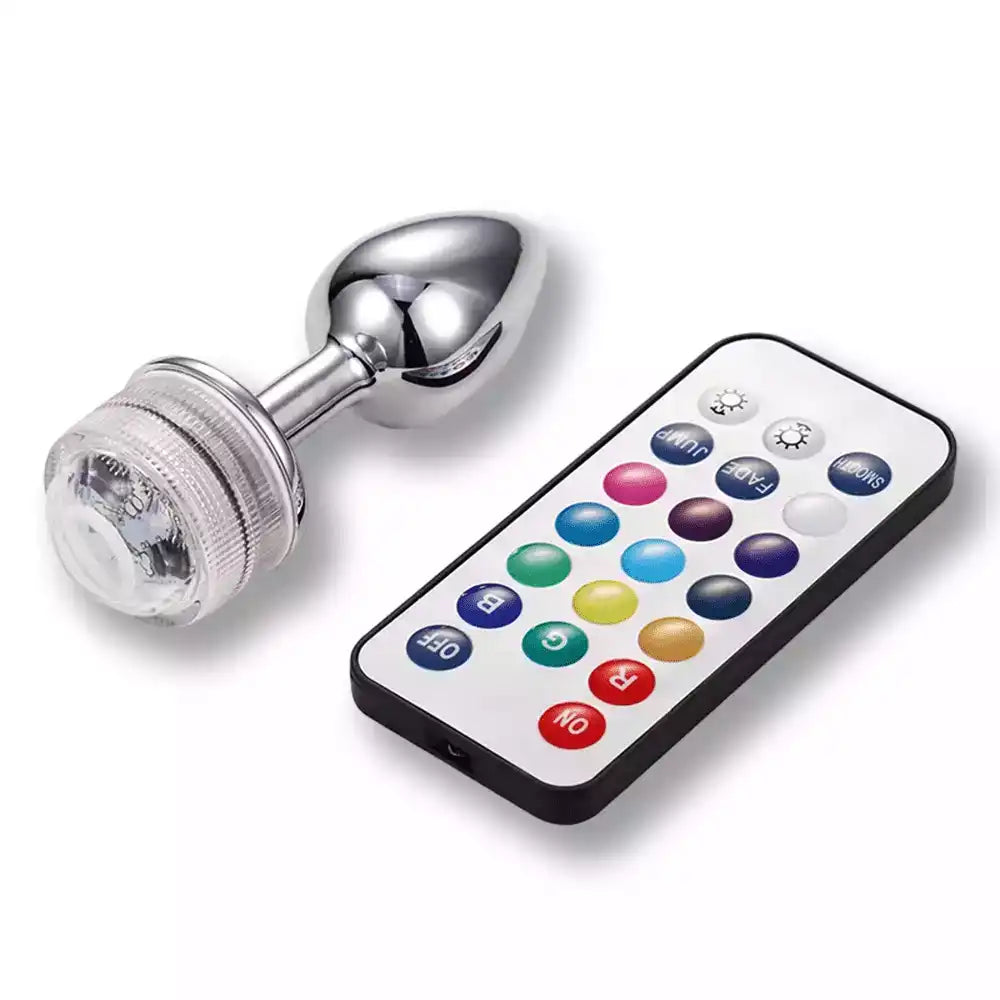 Plug anal en métal chromé avec télécommande multicolore pour sissification et fétichisme sur Sissyshop