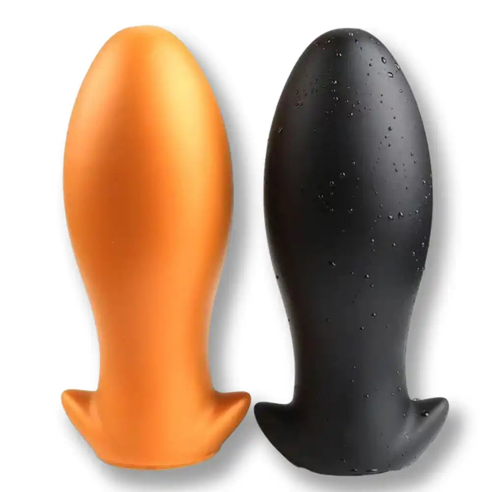 Vue comparative du plug anal Dragon Egg en silicone, proposé en coloris orange et noir.