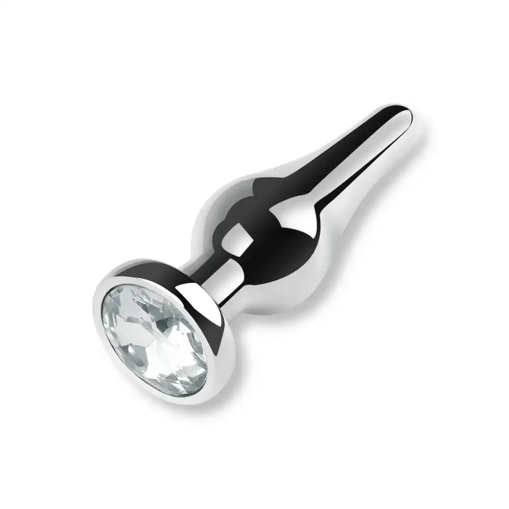 Plug anal en métal argenté orné d'un strass blanc transparent effet plug diamant, idéal pour débuter le plug anal et la sissification sur sissyshop.