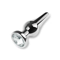 Plug anal en métal argenté orné d'un strass blanc transparent effet plug diamant, idéal pour débuter le plug anal et la sissification sur sissyshop.