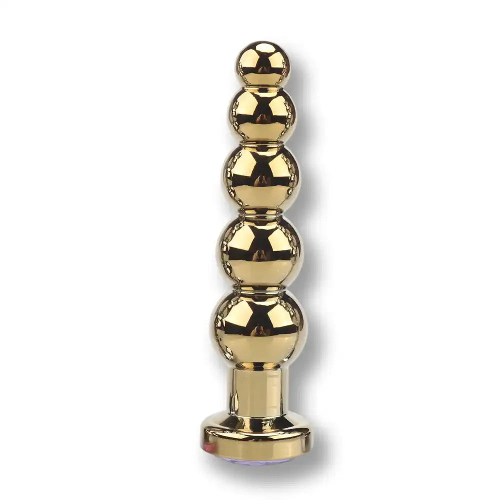 Plug anal métal doré en chapelet à billes graduées avec base plate et bijou, plug anal pour homme et sissy sur Le Sissyshop.