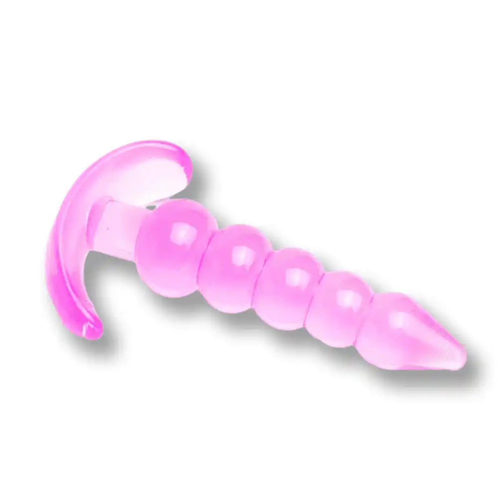 Plug anal rose en silicone souple avec perles et anneau de retenue pour sissification et plaisir anal sur Sissyshop