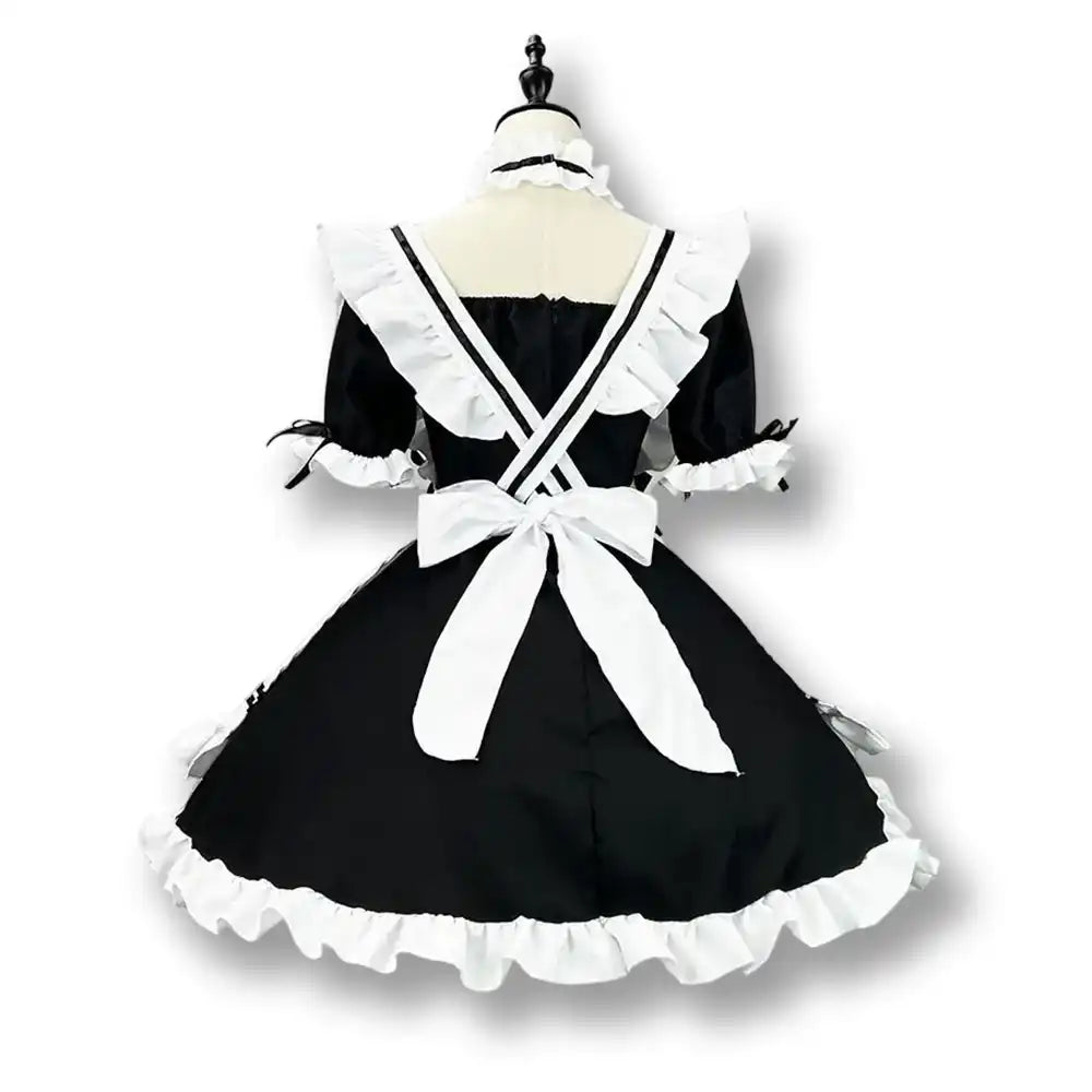 Robe de sissification noire et blanche en satin avec volants et nœud, idéale pour la féminisation et le crossdressing sur Sissyshop